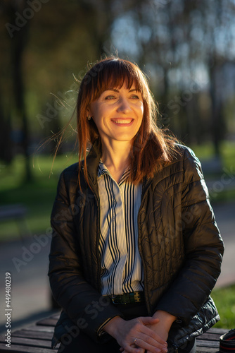 Portrait of a young beautiful girl in the park close-up.