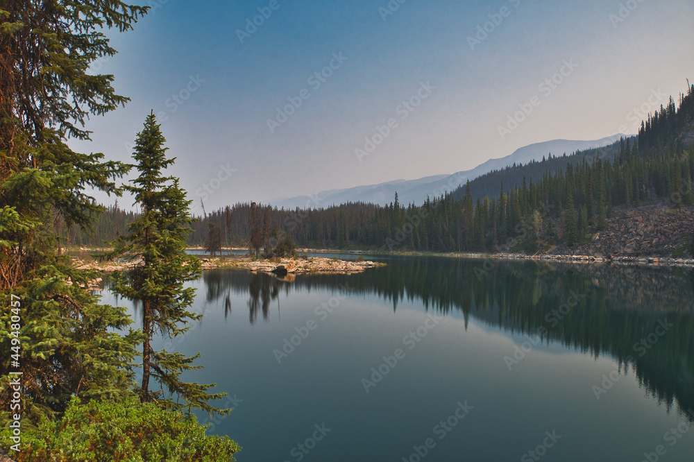 Symmetry mirror images in Horseshoe lake.  Jasper AB Canada 

