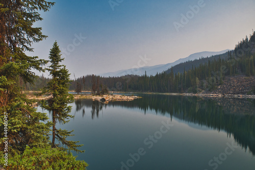Symmetry mirror images in Horseshoe lake. Jasper AB Canada 