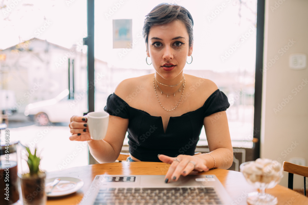 POV view of smiling millennial woman have pleasant Webcam conference in cafe,  happy young female speak talk on video call online, use wireless Internet  and laptop at cafe. foto de Stock