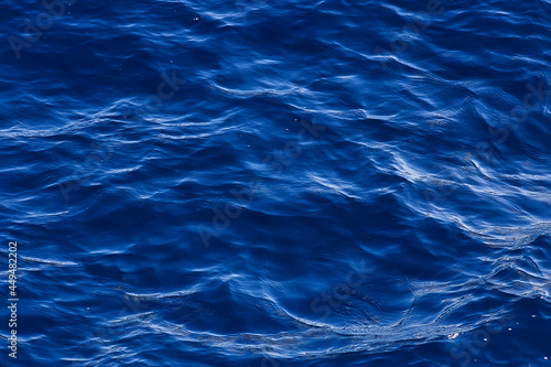abstract background, texture sea blue water, waves and ripples on the ocean, sea pattern wallpaper