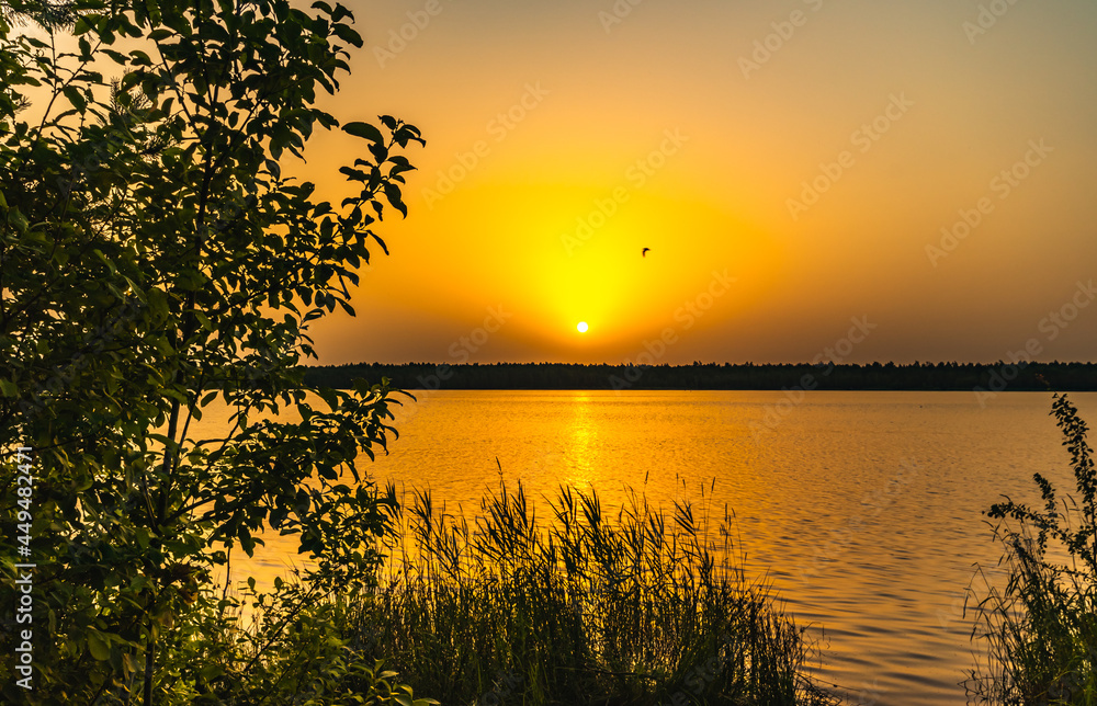 beautiful gentle sunset over a quiet summer lake