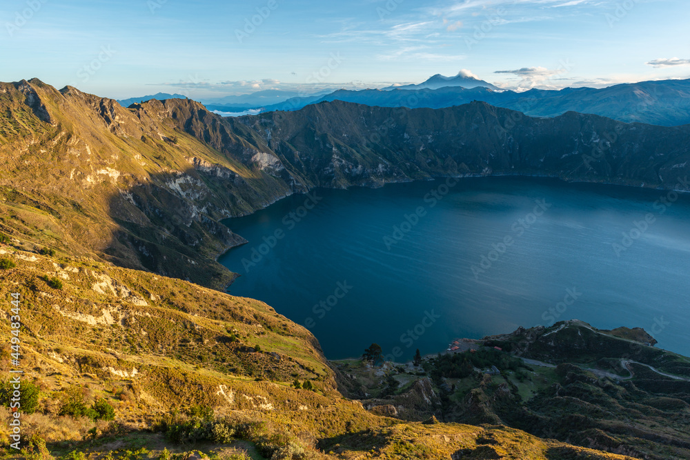 Quilotoa volcanic crater lagoon at sunrise, Quilotoa village, Ecuador.