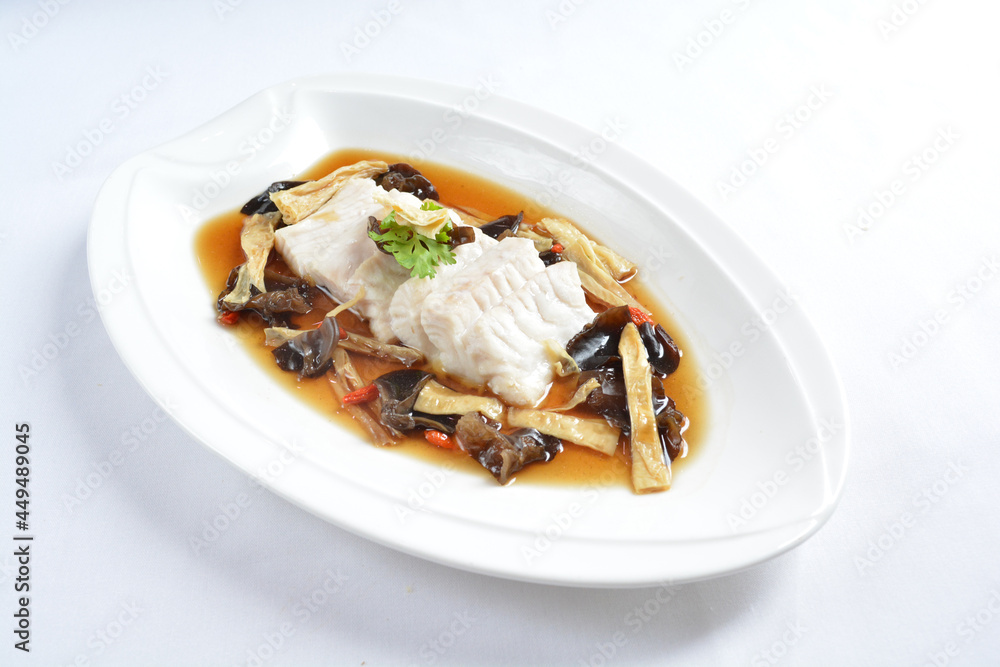 steamed slices grouper fish fillet with Chinese herbal fungus miso sauce seafood in white background asian halal seafood menu