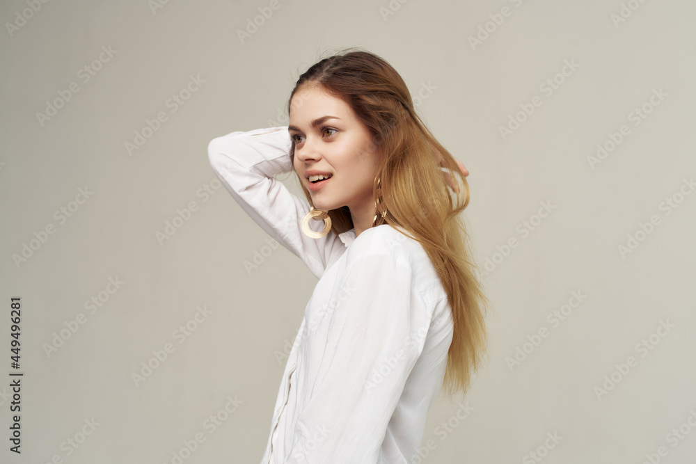 attractive woman with earrings holding hair posing fashion attractive woman with earrings holding hair posing fashion