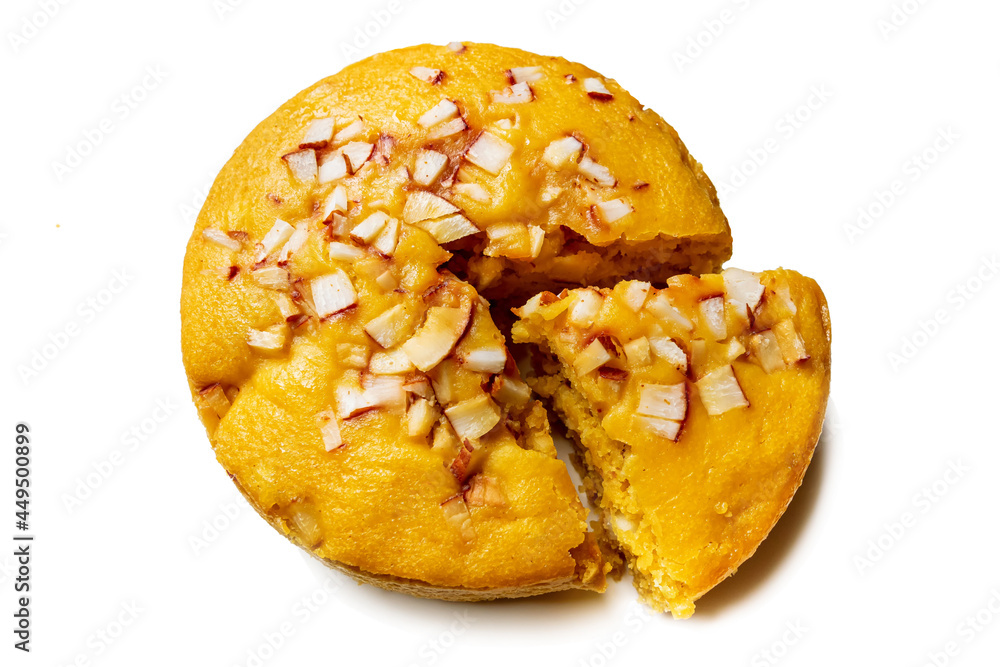 A large-sized ripe palmyra palm fruit cake sprinkled with coconut pieces. Steamed palmyra palm cake in isolated white background. A large-sized ripe palmyra palm fruit cake sprinkled with coconut pieces. Steamed palmyra palm cake in isolated white background.