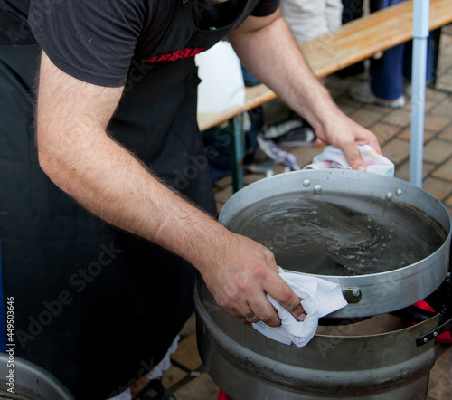 Elaboración de chipirones en su tinta para el concurso gastronómico de la Aste Nagusia (Semana Grande). Bilbao 2012 photo