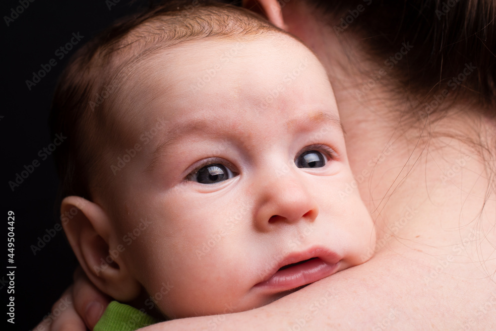 close-up portrait of baby, together with mom. Large glare in the eyes. close-up portrait of baby, together with mom. Large glare in the eyes.