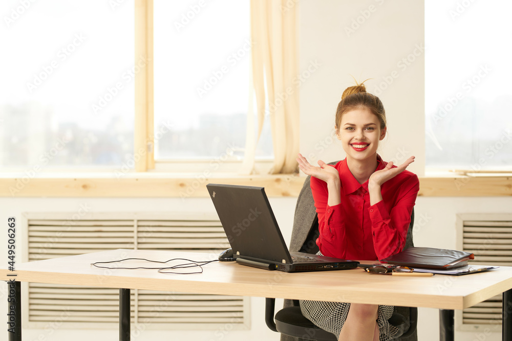 Business woman sitting at work table in front of laptop secretary Business woman sitting at work table in front of laptop secretary