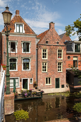 Old houses along the canal in the picturesque town of Appingedam in the province of Groningen; Netherlands. photo