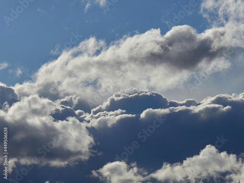White cumulus clouds on a blue sky. photo