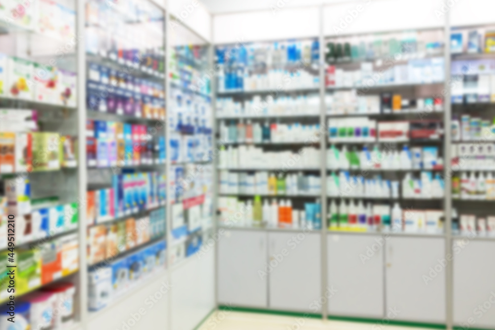 Close-up shot of blurred interior of pharmacy - sales area and showcases with medicines