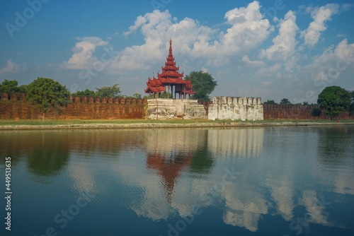 An ancient gate with a bastion with a reflection. Mandalay, Burma (Myanmar)