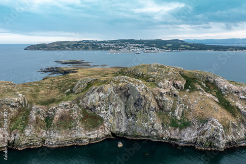 View from the sea over Ireland's Eye Island to Howth harbor