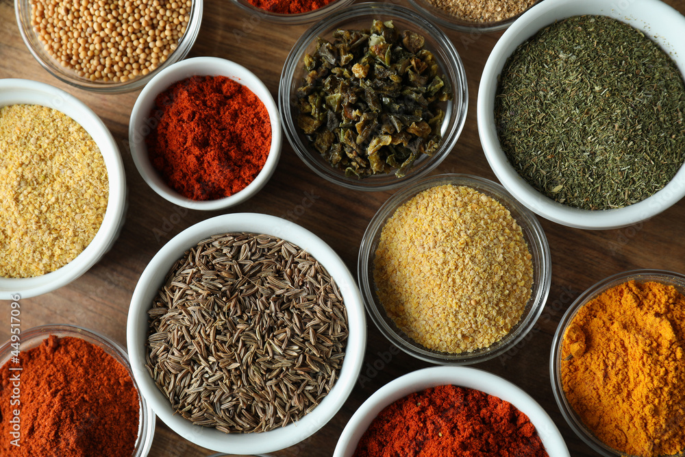 Bowls with different aromatic spices, top view