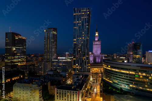 Warsaw by night. Amazing lights, skyscrapers and bridges over the Vistula River. View of the glowing lights in Warsaw from the drone. The capital of Poland miraculously shown at night.