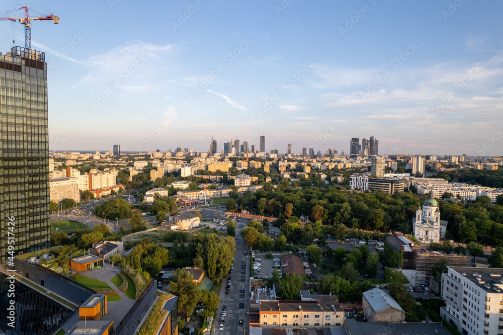 Obraz premium Warsaw during the day. Busy city seen from above on a beautiful sunny day. The largest city in Poland, shown in a wonderful way.