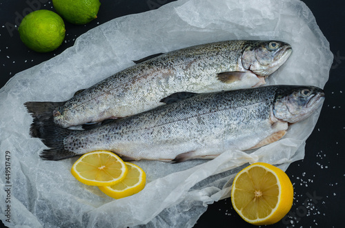 Two raw trout with lemon and lime
