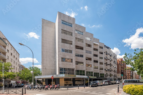 facades of buildings within the city of Madrid, this facade covered in white marble