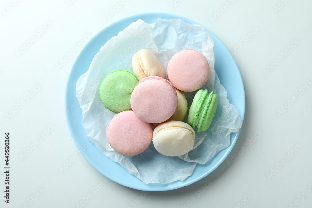 Concept of tasty dessert with macaroons on white background Concept of tasty dessert with macaroons on white background
