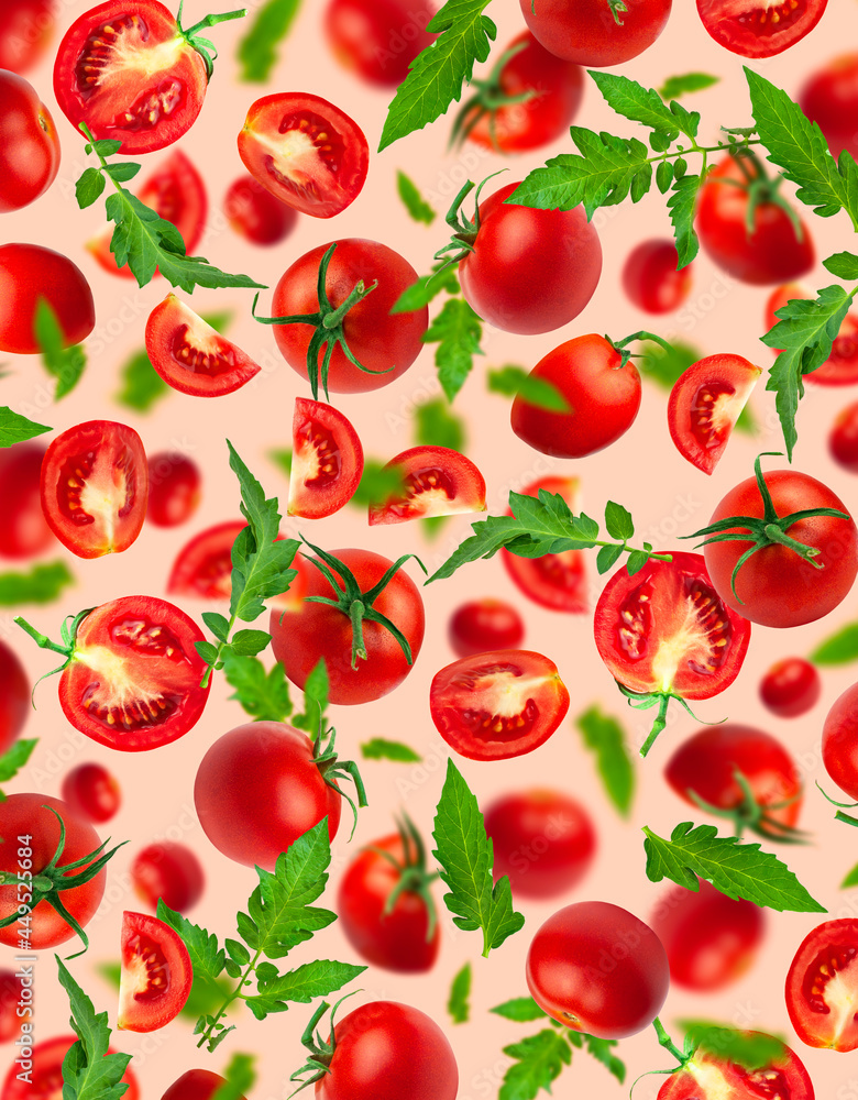 Creative food concept. Tomatoes pattern. Flying red ripe juicy tomatoes and green leaves on pink background. Healthy vegan organic food, vegetable, cherry tomatoes, summer, harvesting Creative food concept. Tomatoes pattern. Flying red ripe juicy tomatoes and green leaves on pink background. Healthy vegan organic food, vegetable, cherry tomatoes, summer, harvesting
