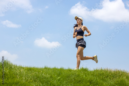 Young asian girls running and fitness in the morning