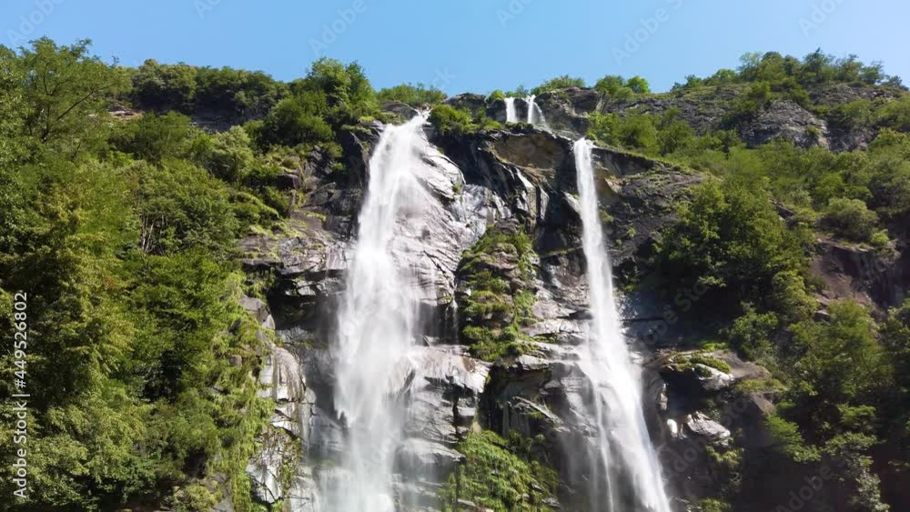 Water stream running from the beautiful Acquafraggia waterfall in Piuro, in the Bregaglia valley in Italy, before the ascent to the Maloja pass. It is a beautiful sunny summer day. Water stream running from the beautiful Acquafraggia waterfall in Piuro, in the Bregaglia valley in Italy, before the ascent to the Maloja pass. It is a beautiful sunny summer day.