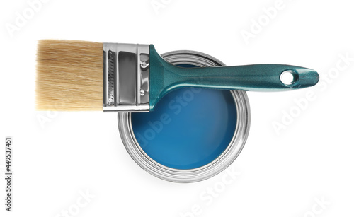 Can of blue paint and brush on white background, top view