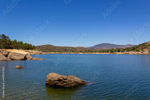 Landscape of a lake or swamp with reflections in the water. Ávila, Spain.