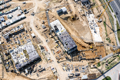 large construction site from above. construction of new residential buildings. aerial top drone view.