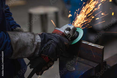 Metal workers use manual labor. Skilled welder.Technicians use steel cutting tools to cut steel. Metal cutting. The worker uses gas to cut steel. content work safety