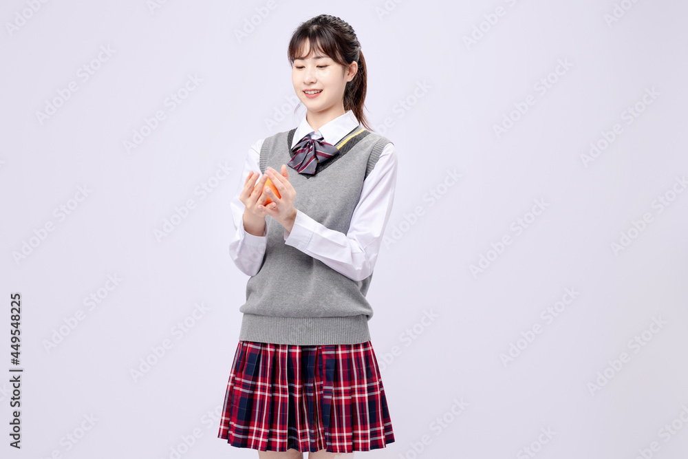 Beautiful Asian girl in middle school uniform Stock Photo | Adobe Stock