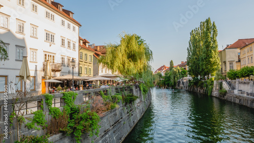 Beautiful streets of Ljubljana and river Ljublajnica in Slovenia in the first rays of sun.