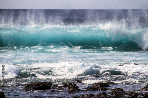 sea landscape  blue sea waves crashing against the rocks  big turquoise wave in the ocean