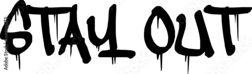 STAY OUT black spray paint sign. Words Stay out written with paint, paint smudges on it. Street wall painting style.