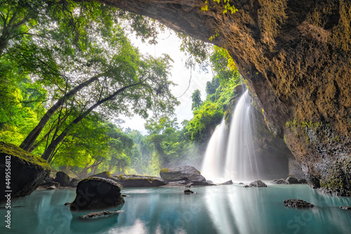 Waterfall in tropical forest at Khao Yai National Park, Thailand. Waterfall view from inside the cave. Amazing of Haew Suwat Waterfall Unseen Khao Yai National Park, Thailand. traveling ecotourism. photo