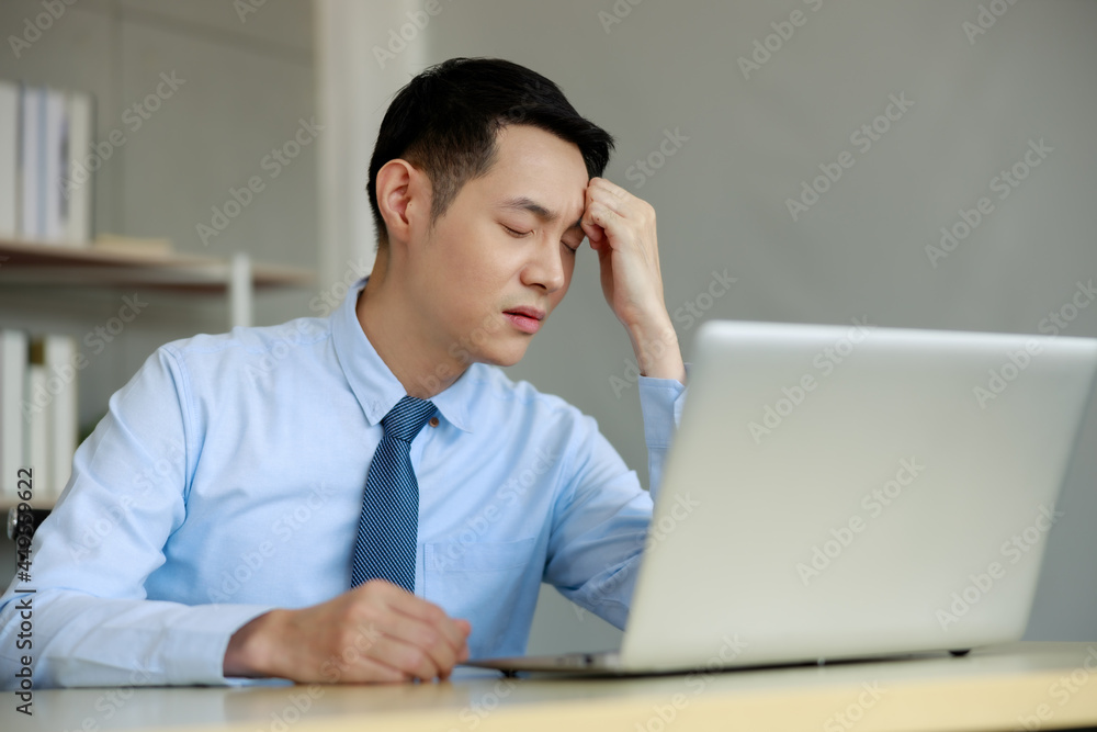 asian businessmann stressed for working project deadline in office asian businessmann stressed for working project deadline in office