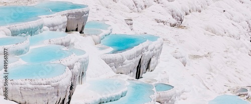 Pamukkale Turkey, calcium cascade terraces of white stalactites. Beautiful landscape nature banner. Cotton castle in southwestern Turkey.