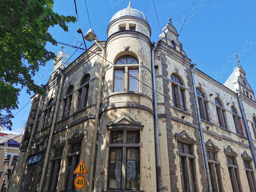 A building with towers and a dome, decorated with granite, built in 1890, on a sunny summer day in Vyborg.