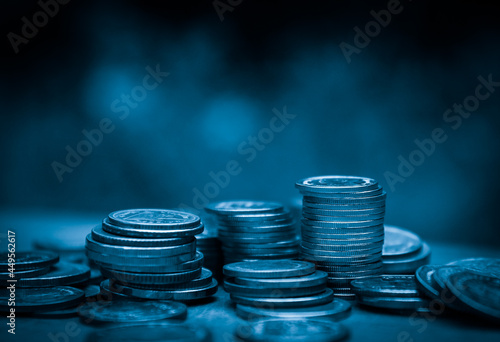 Double exposure of finance graph , stationary and rows of coins for goal office , finance and business concept background and forex trading graph with economy trends business or finance background.