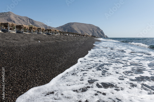 Fototapeta Naklejka Na Ścianę i Meble -  empty Black Sand beach in Santorini Greece early morning 