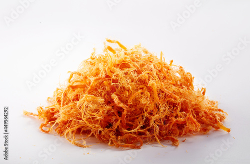 Delicious fresh meat floss on a white background