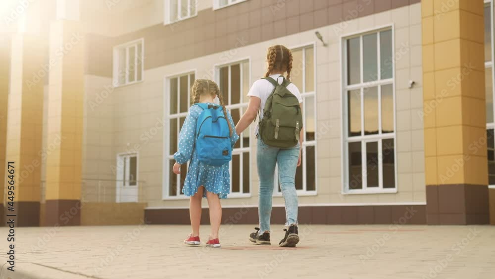 back to school. kids a walk to school for lesson. education training support concept. child walk to school with a backpack. kids rush to school. family lifestyle day. group kids with backpacks back to school. kids a walk to school for lesson. education training support concept. child walk to school with a backpack. kids rush to school. family lifestyle day. group kids with backpacks
