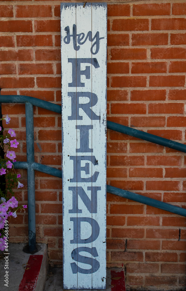 A friendly sign against a brick wall A friendly sign against a brick wall