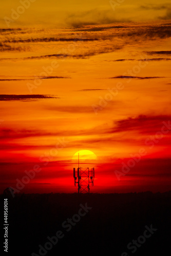sunset and telephone towers.