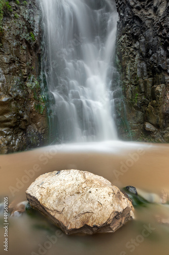 Beautiful waterfalls in Wadi Nakhlan in Al Sayani District, Ibb Governorate, Yemen. After the rain mud mix with water turn color to brown. photo