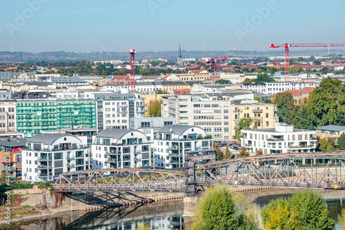 Bird view at modern living district at Elbe river side in Magdeburg during golden Autumn at blue sky and sunny day, Magdeburg, Germany.