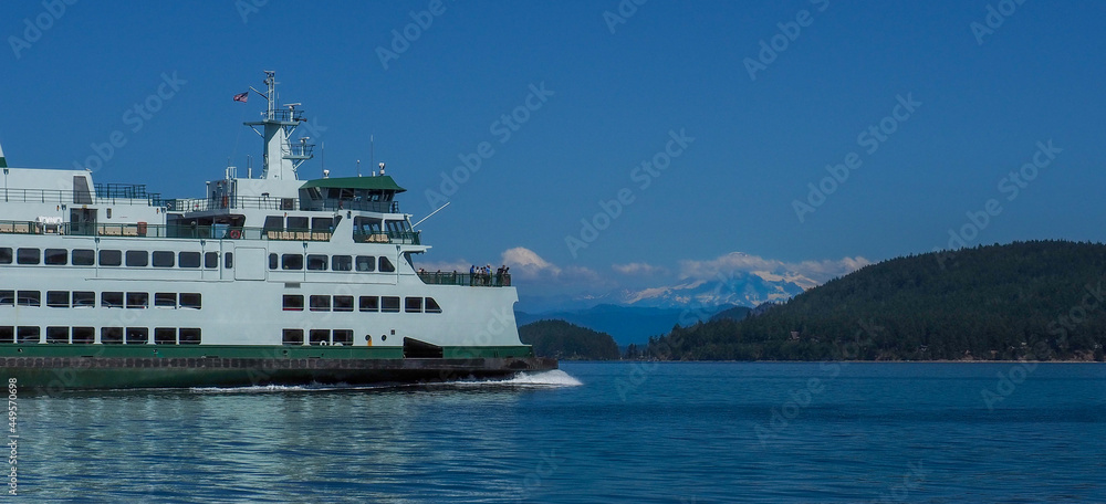 Washington State Ferry underway in the San Juan Islands with Mount Baker in the background.