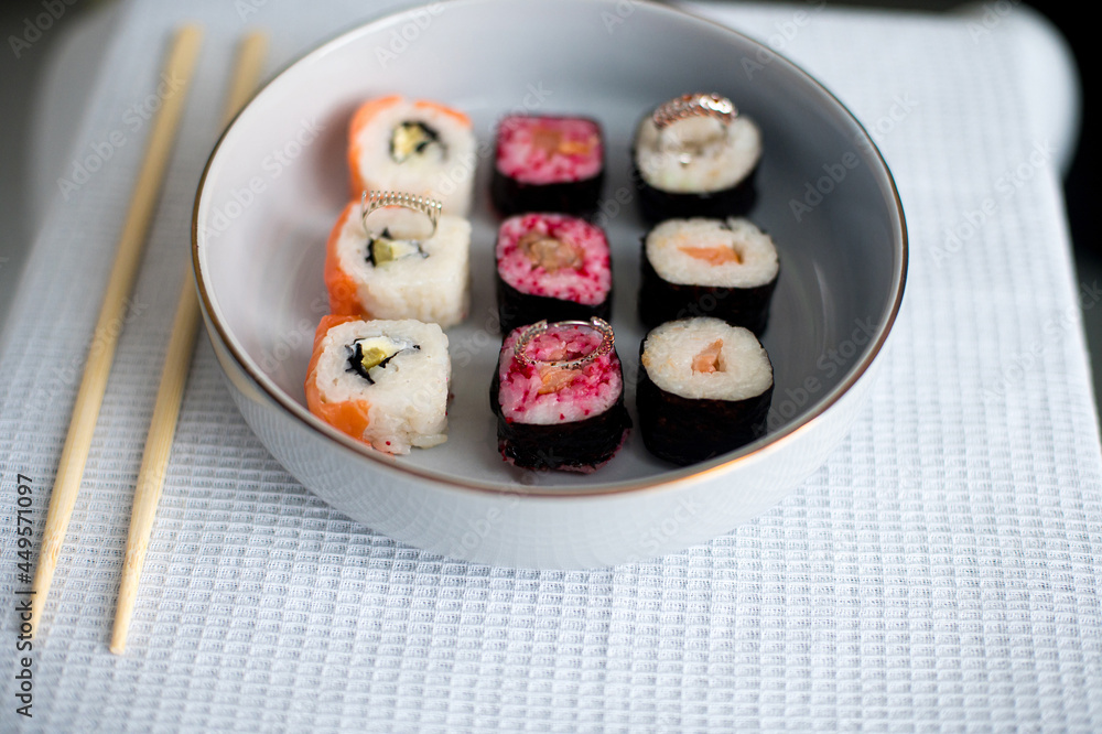 sushi on a plate with chopsticks sushi on a plate with chopsticks