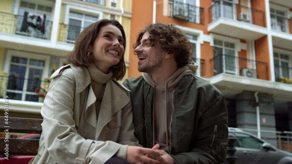 Romantic couple feeling happy outdoor. Man and woman laughing on urban street. Romantic couple feeling happy outdoor. Man and woman laughing on urban street.